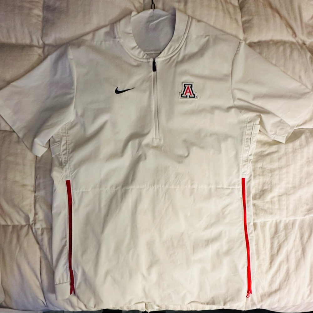 Nike Arizona Wildcats short-sleeve 1/4 zip pullover jacket in white.